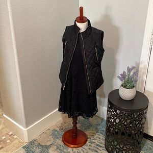 Adorable black vest with gold zipper detail